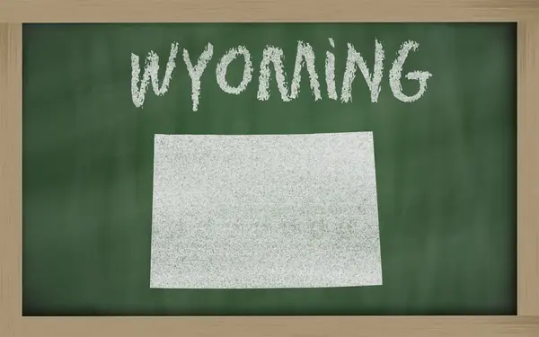 Outline map of wyoming on blackboard — Stock Photo, Image