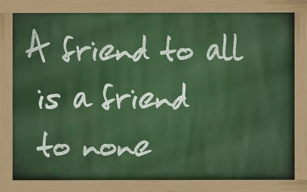 " A friend to all is a friend to none " written on a blackboard — Stock Photo, Image