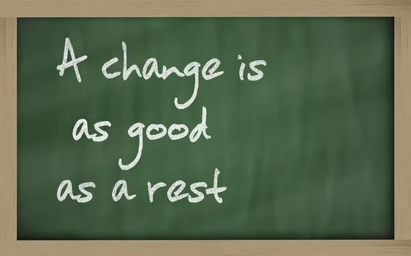 " A change is as good as a rest " written on a blackboard — Stock Photo, Image