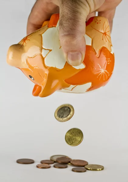 Piggy bank with falling coins — Stock Photo, Image