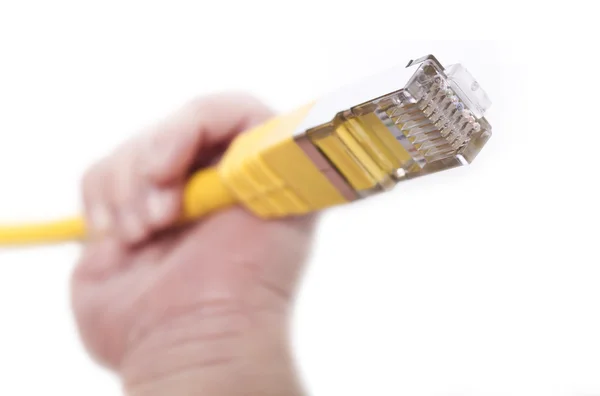 Žlutá síťový kabel v ruce babys — Stock fotografie