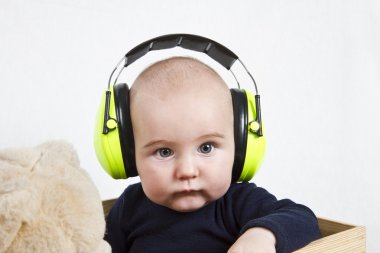 Baby with ear protection clipart