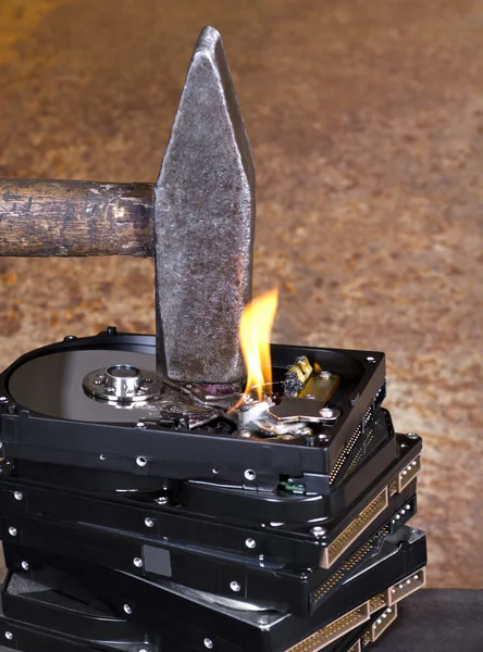 Hammer on stack of hard disk — Stock Photo, Image