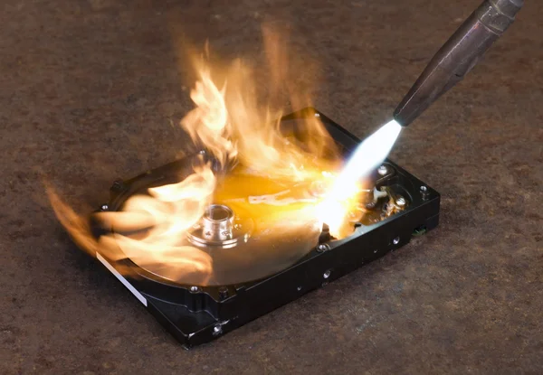 Burning a hard disk drive — Stock Photo, Image