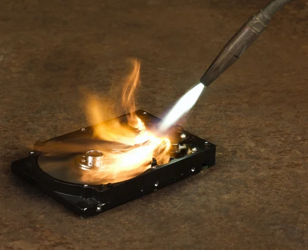 Burning a hard disk drive — Stock Photo, Image