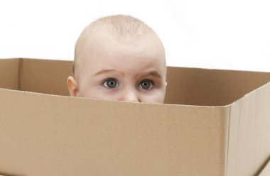 Young child in cardboard box clipart