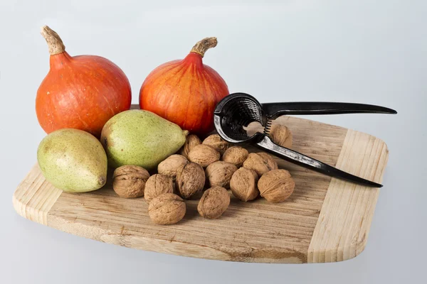 stock image Pear, pumpkin and many nuts