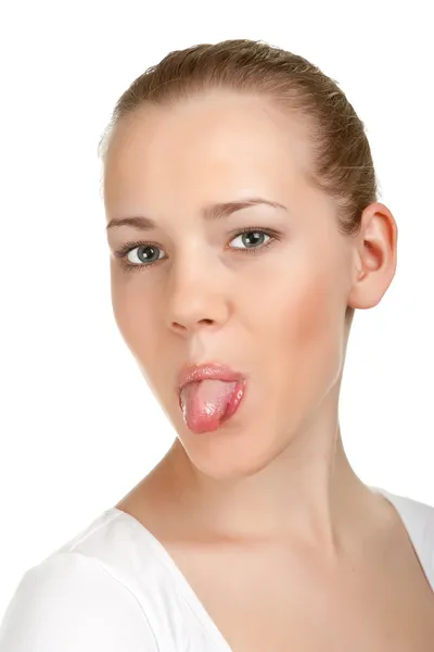 Retrato de sorriso atraente menina adolescente, mostrar sua língua — Fotografia de Stock