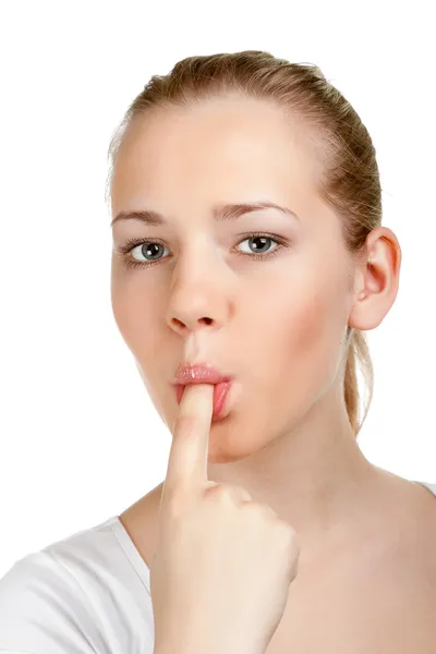 Portrait of a young woman with finger in mouth — Stock Photo, Image