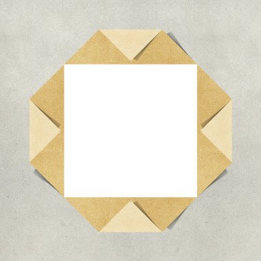 Hole ripped in recycled paper craft on white background clipart