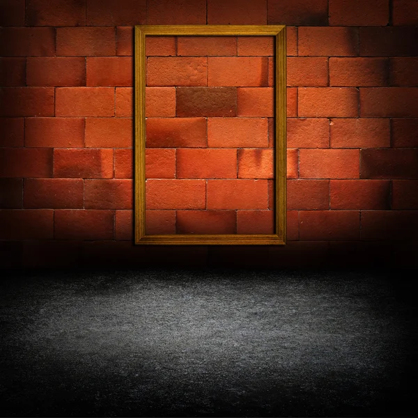 Picture frames on red brick wall