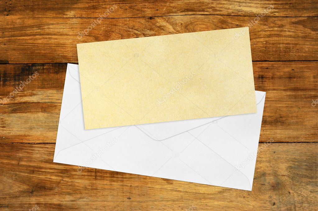 Vintage Envelope with blank Brown paper on wood