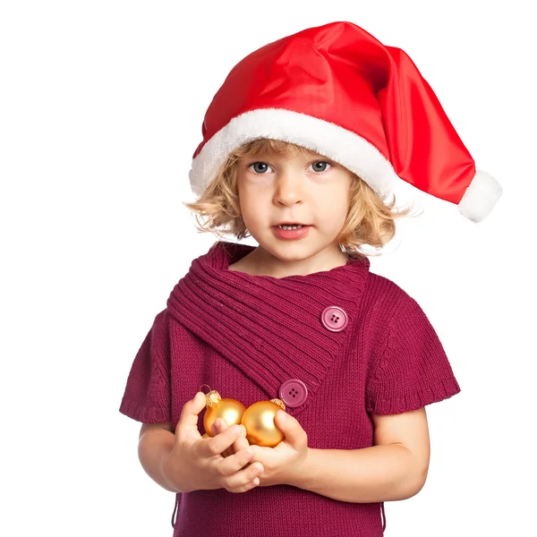 Gelukkig meisje in Kerstman hoed met kerstballen op witte achtergrond — Stockfoto