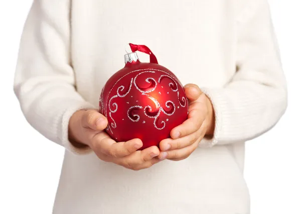 Children's hands holding Christmas ball — Stock Photo, Image