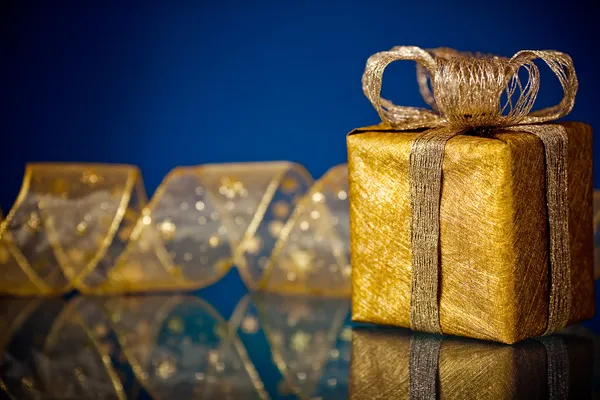 Christmas gift on blue — Stock Photo, Image