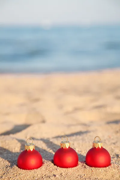 stock image Christmas balls on sea coast