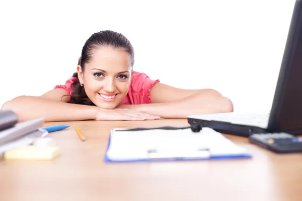 Portrait of relaxed young business woman smiling at office — Stock Photo, Image