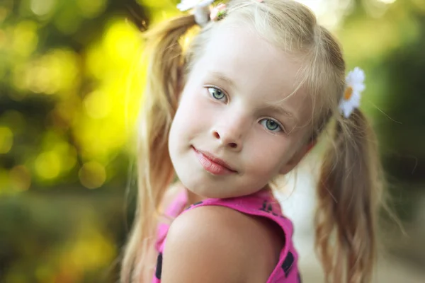 Portrait of the beautiful blonde little girl on nature — Stock Photo, Image