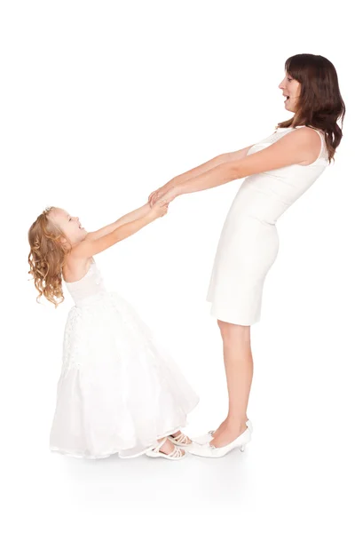 Mãe feliz de mãos dadas sua filha isolada no backgr branco — Fotografia de Stock
