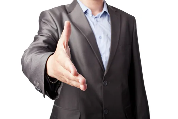 Empresário estendendo a mão para agitar isolado no fundo branco — Fotografia de Stock