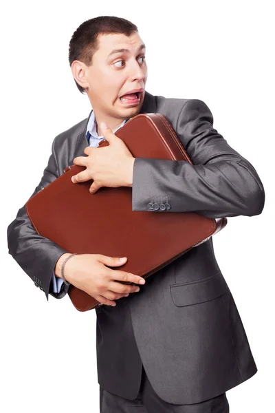 Молодий бізнесмен обіймає портфель ізольовано на білому фоні — стокове фото