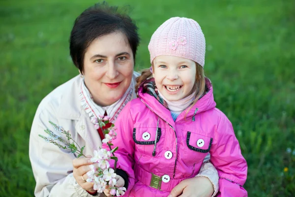 Mature woman and funny little girl — Stock Photo, Image