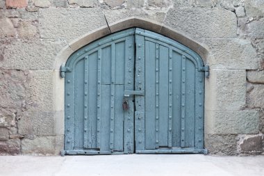 Ancient wooden gate of a palace clipart