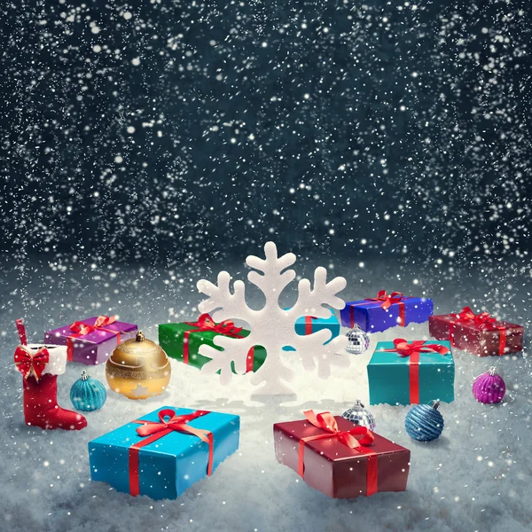 stock image Christmas gift box with christmas balls and big snowflake on sno