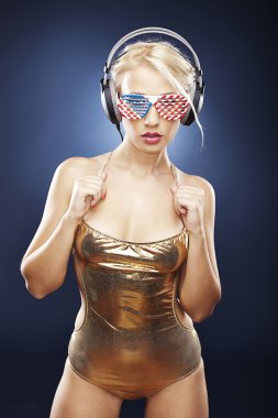 Beautiful girl in gold swimwear clipart