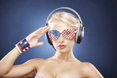 Portrait of model in gold swimwear and American inspired access clipart