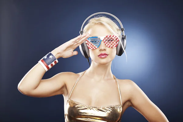 stock image Beautiful girl in gold swimwear and American inspired accessorie