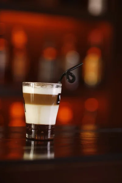 Triple layered coffee drink in a shot glass. — Stock Photo, Image