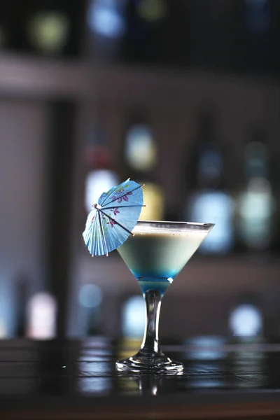 Beautiful blue, creamy cocktail in a martini glass with a blue u — Stock Photo, Image
