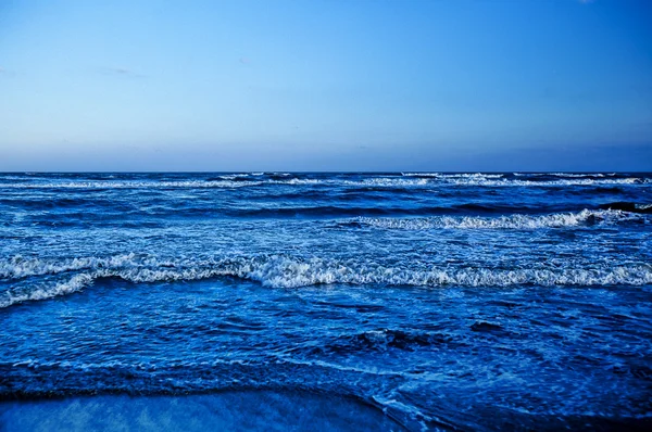 Waves breaking at shore