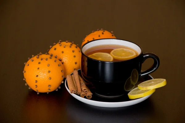 Warm drink with orange and lemon — Stock Photo, Image