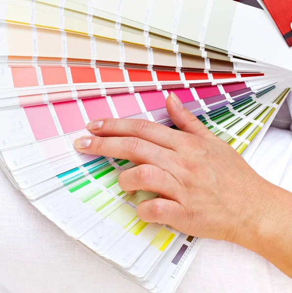Color chart and woman hand — Stock Photo, Image