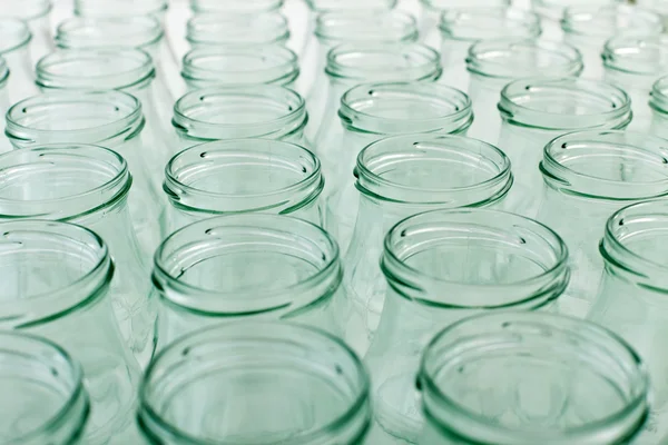 Lots of empty jars background — Stock Photo, Image