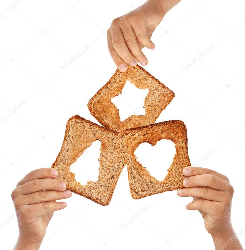 Hands holding bread with christmas symbols