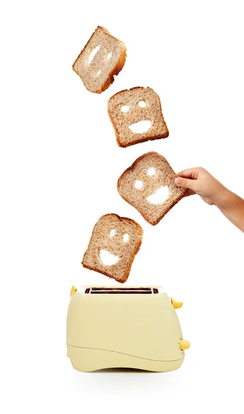 Toast bröd och brödrost på vit — Stockfoto