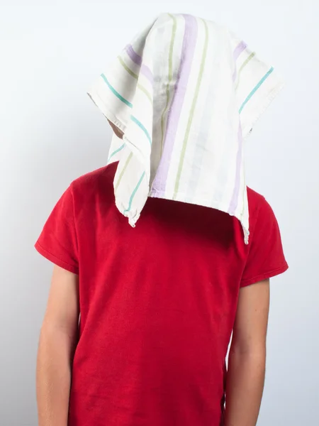 Child with head hidden from duster — Stock Photo, Image