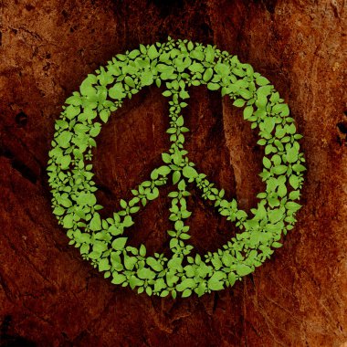 taş zemin üzerine yeşil barış işareti