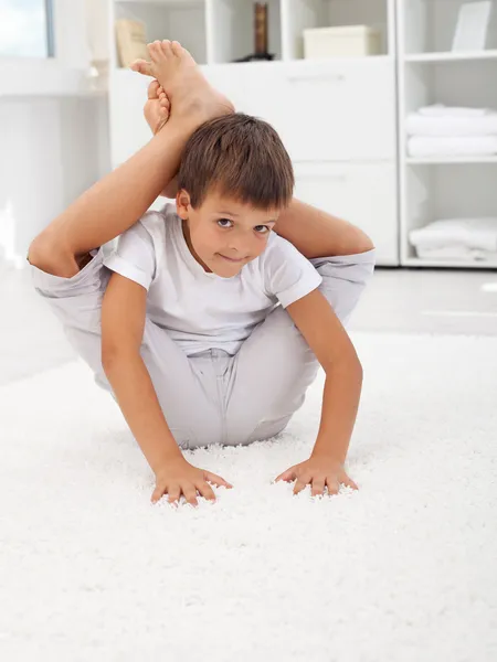 Little contortionist boy — Stock Photo, Image