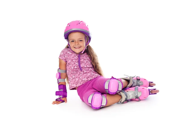 Niña con patines de ruedas descansando — Foto de Stock