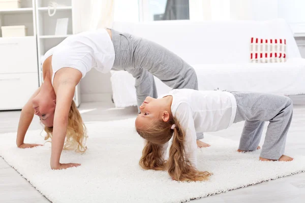 Healthy doing gymnastic exercises at home — Stock Photo, Image
