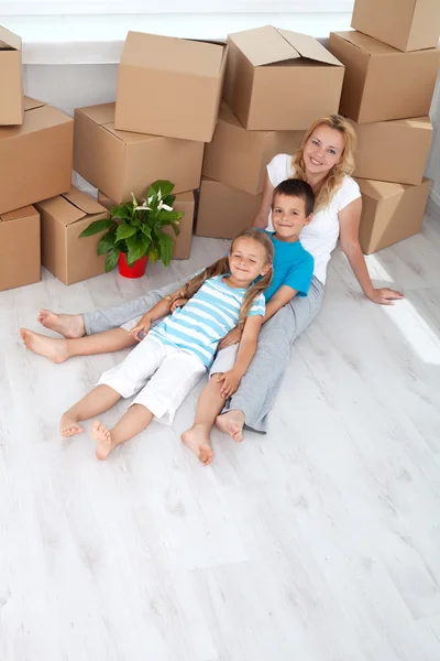 Family relaxing in their new home — Stock Photo, Image