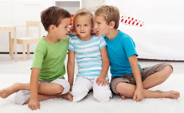 Boys whispering to a girl — Stock Photo, Image
