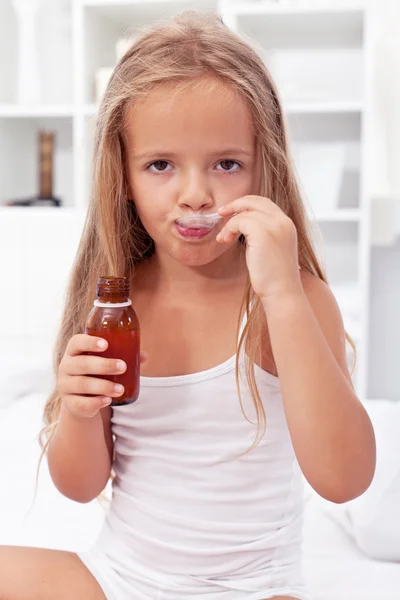 Little girl taking medication — Stock Photo, Image