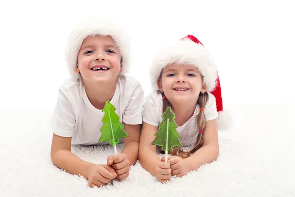 Crianças com doces na época do Natal — Fotografia de Stock
