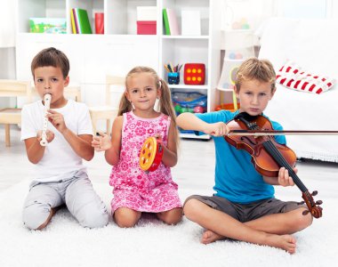 Kids playing on musical instruments clipart