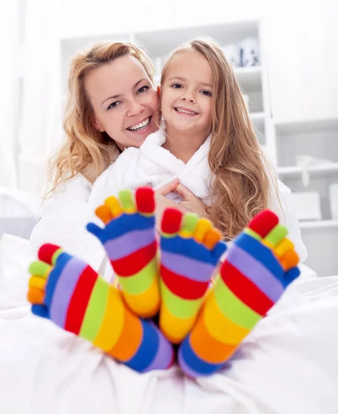 Happy girl and woman at home — Stock Photo, Image
